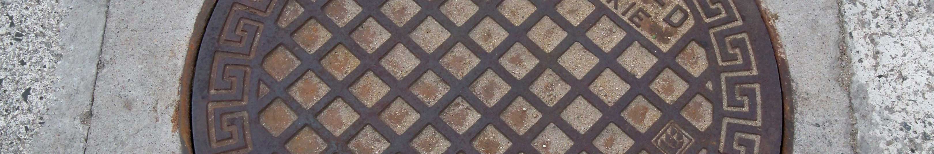 Pokrywa studzienki kanalizacyjnej